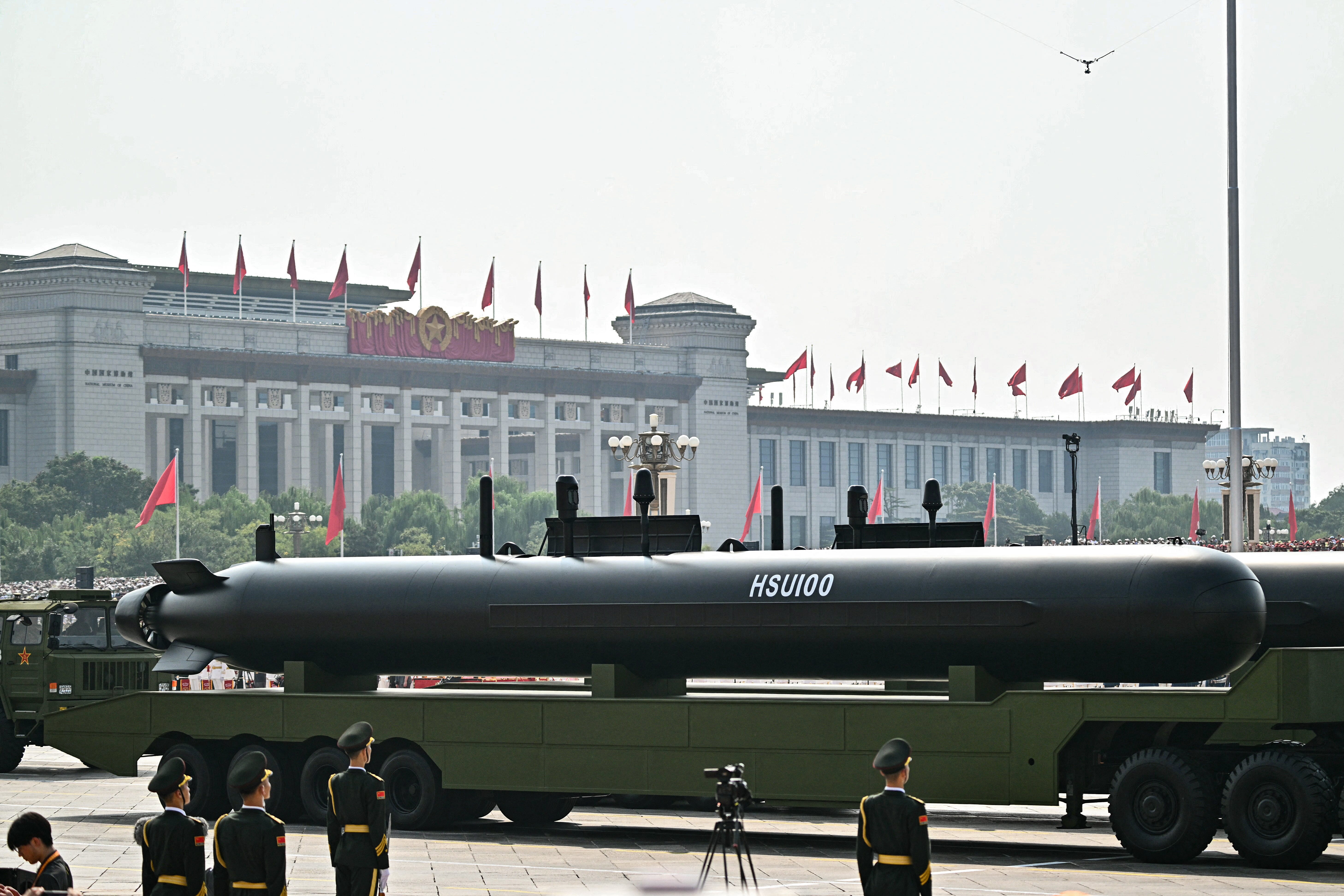 The HSU100 uncrewed underwater vehicle is seen mounted on a long truck during a military parade.