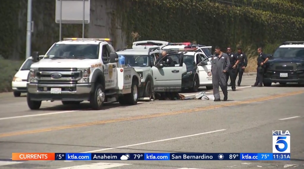 Police towing the woman's Ford Bronco, which contained a dog.