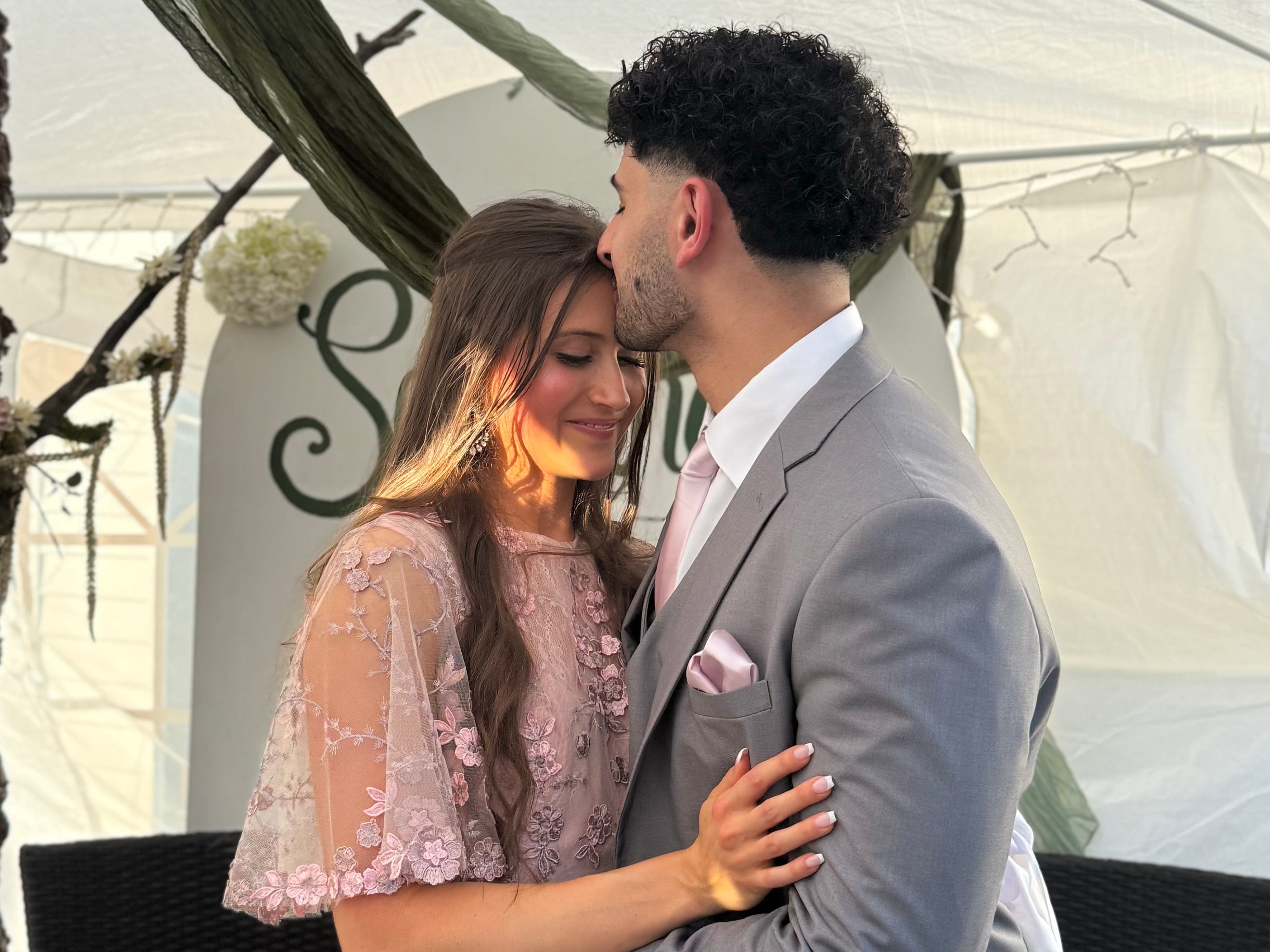 Couple posing for photo