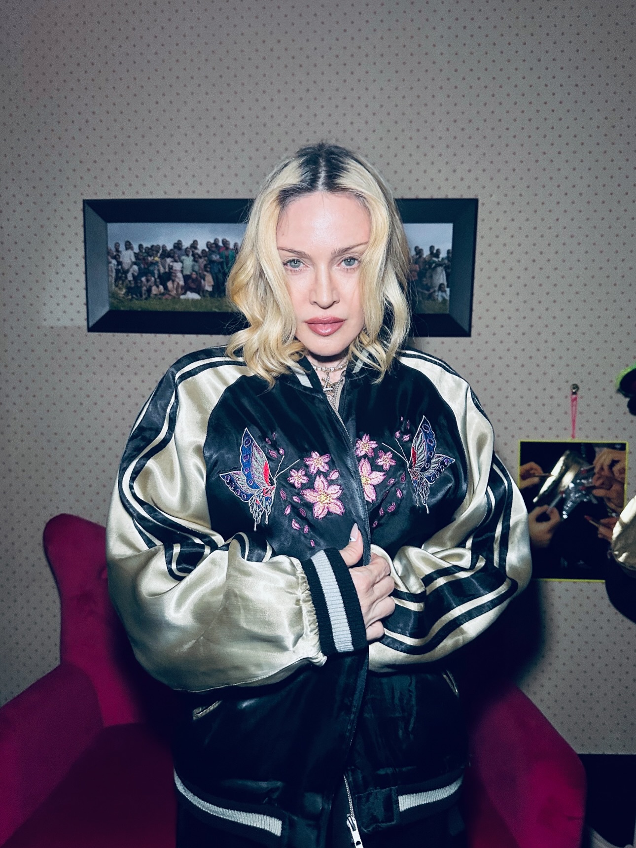 Madonna shows off a butterfly embroidered jacket. 