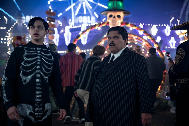 Isaac Ordonez as Pugsley Addams and Luis Guzmán as Gomez Addams.
