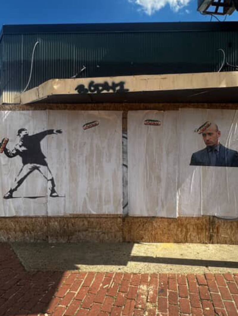 Subway slinger Sean Dunn is the subject of Banksy-style graffiti targeting the Trump administration officials across DC. This one in Anacostia featured Stephen Miller getting hit by a sandwich.