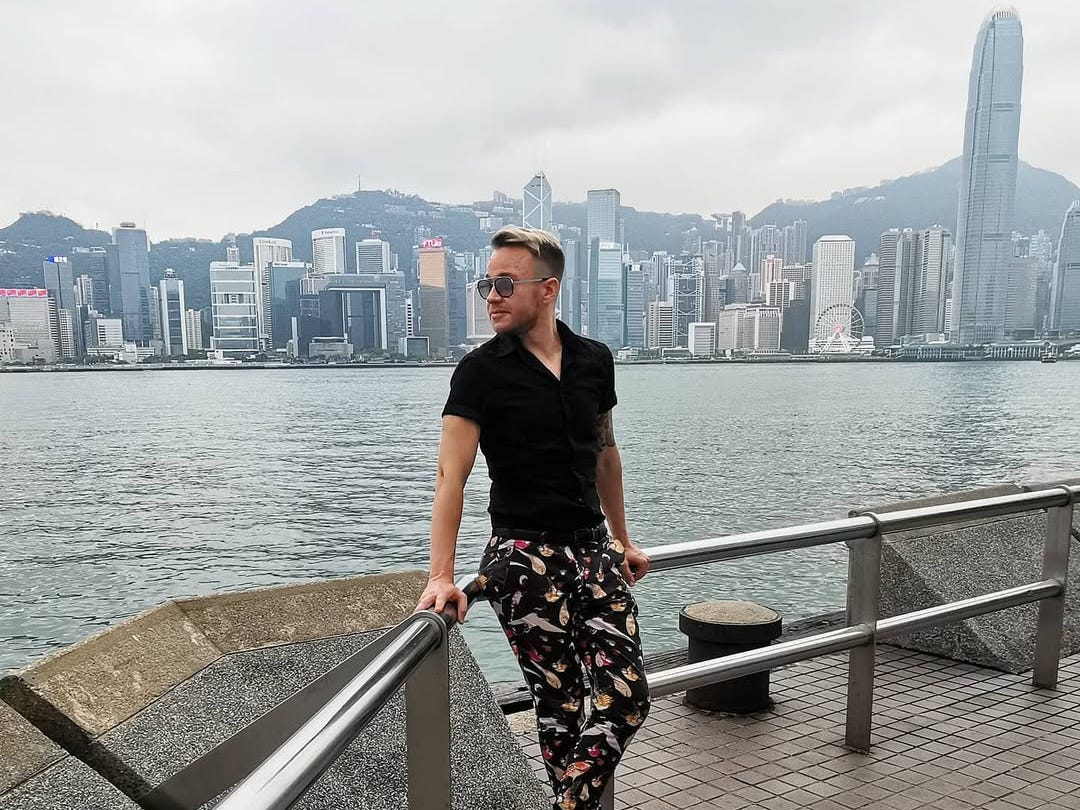 Andre Neveling posing with Hong Kong in the background.