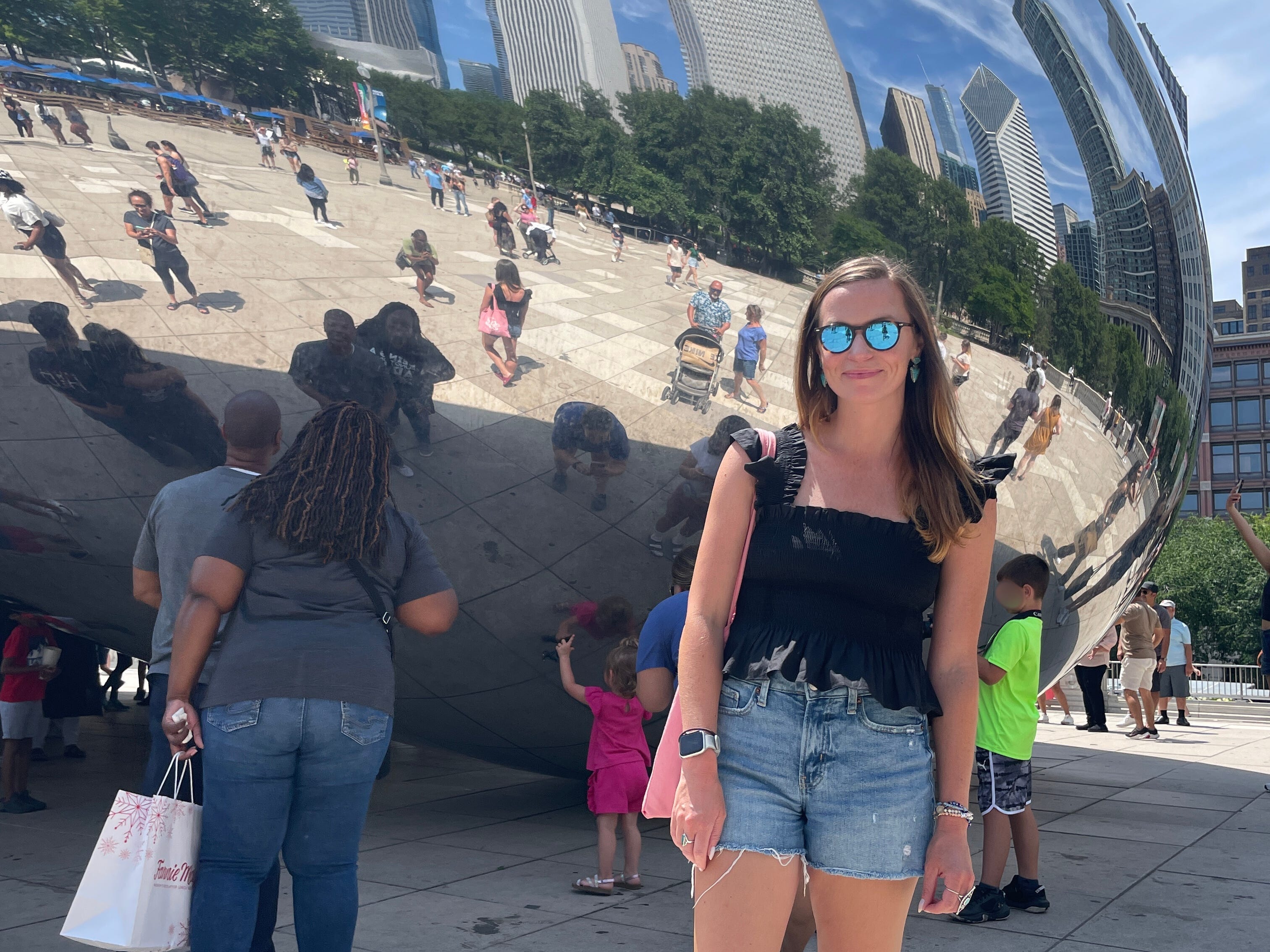 Emily standing in front of The Bean in Millennium Park in Chicago.