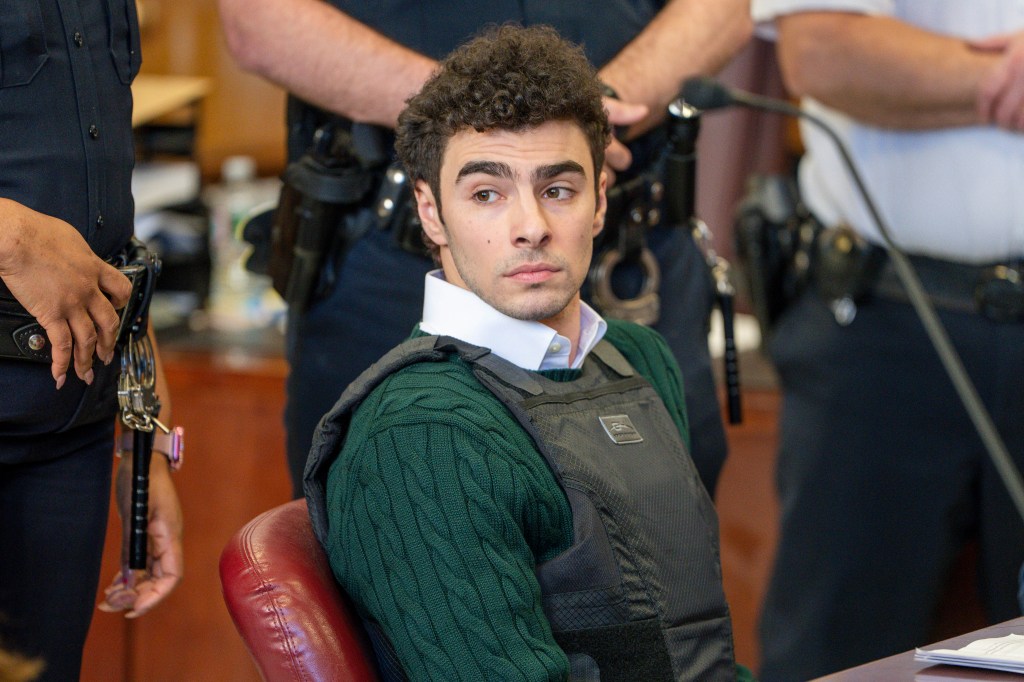 Luigi Mangione in court, wearing a bulletproof vest.
