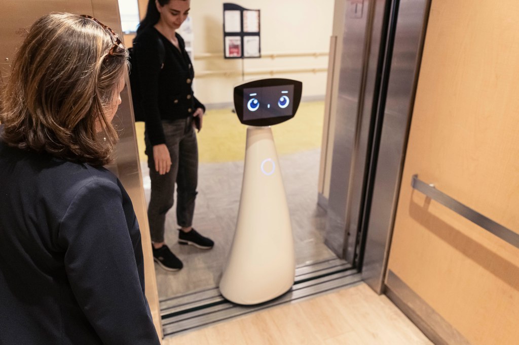 A robot in a hospital elevator.
