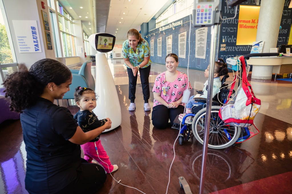 Robin the Robot entertaining children at St. Mary's Children's Hospital.