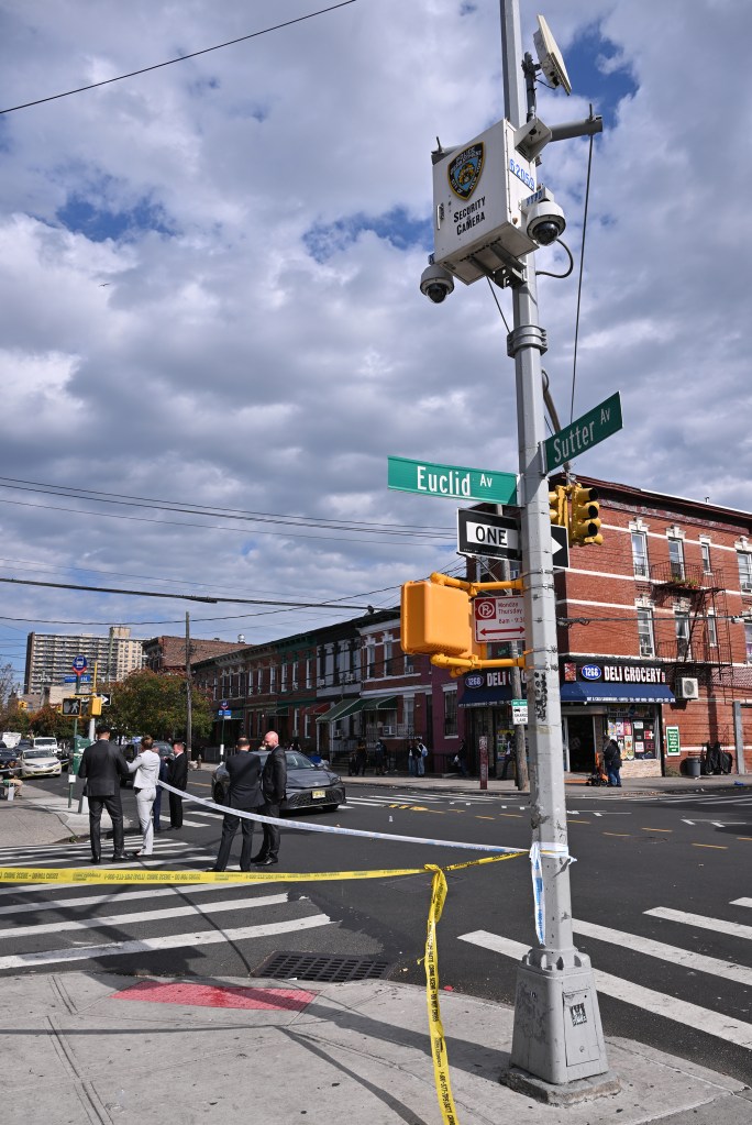 Crime scene in Brooklyn, NY. Police officers are on the scene with crime scene tape.