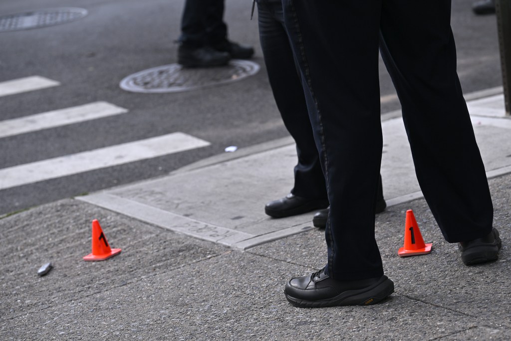 Police officers at a crime scene in Brooklyn.