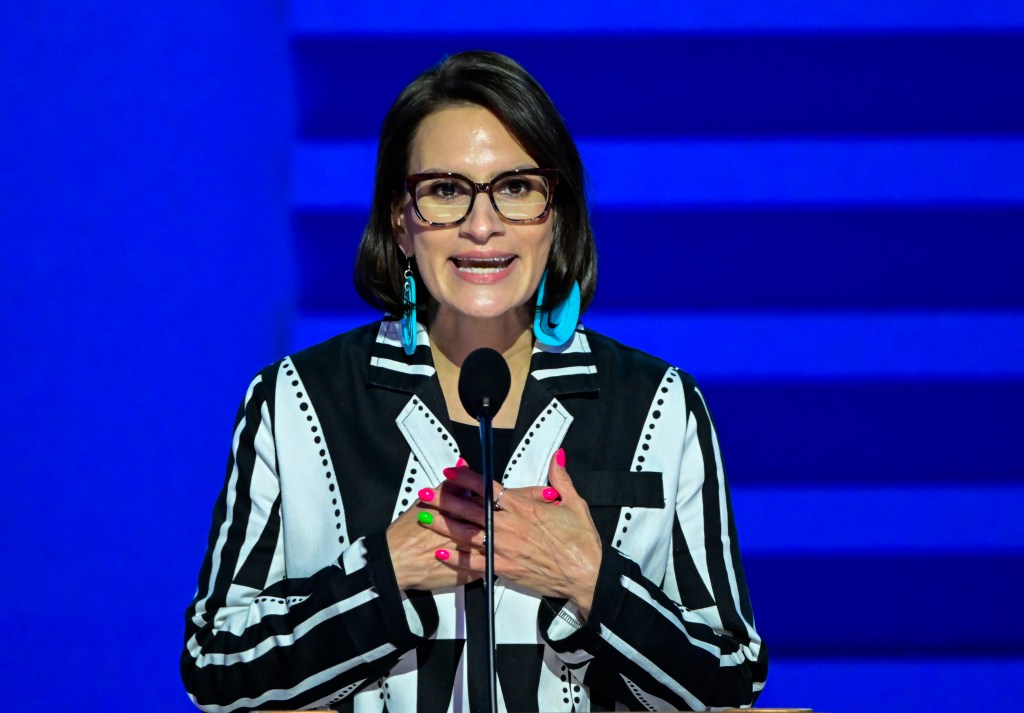 Woman speaking at a podium at the 2024 Democratic National Convention.