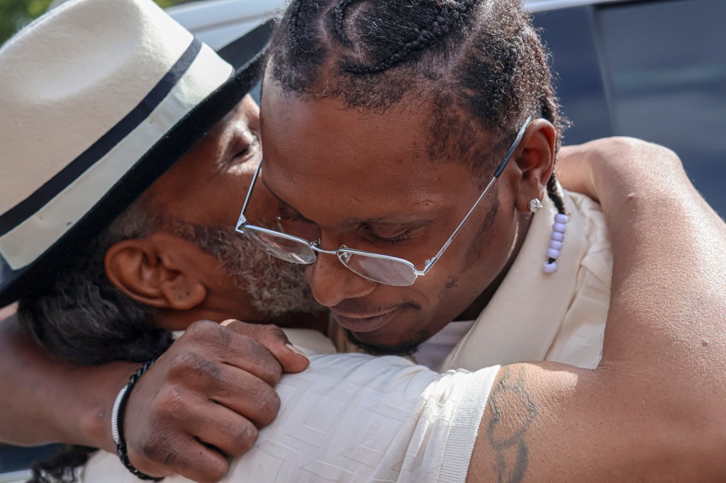 Hooper Sr., left, embraces his son Brian Hooper Jr. outside Stillwater Prison on Sept. 4, 2025 in Bayport, Minn.