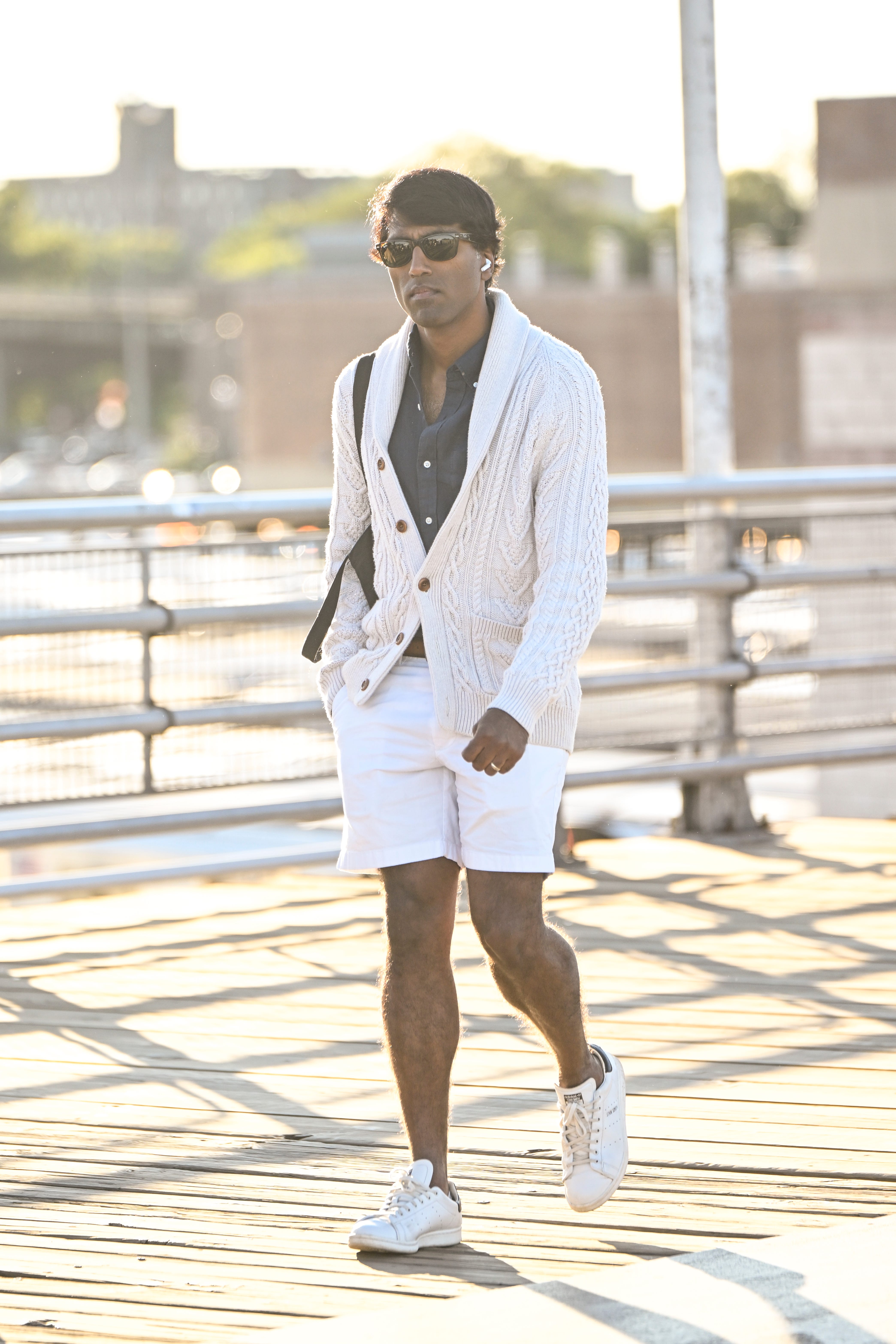 A man in white shorts and a white sweater.