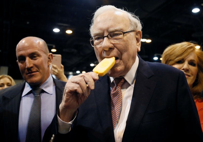 FILE PHOTO: Berkshire Hathaway CEO Warren Buffett enjoys an ice cream treat from Dairy Queen before the Berkshire Hathaway annual meeting in Omaha, Nebraska, U.S. May 6, 2017. REUTERS/Rick Wilking