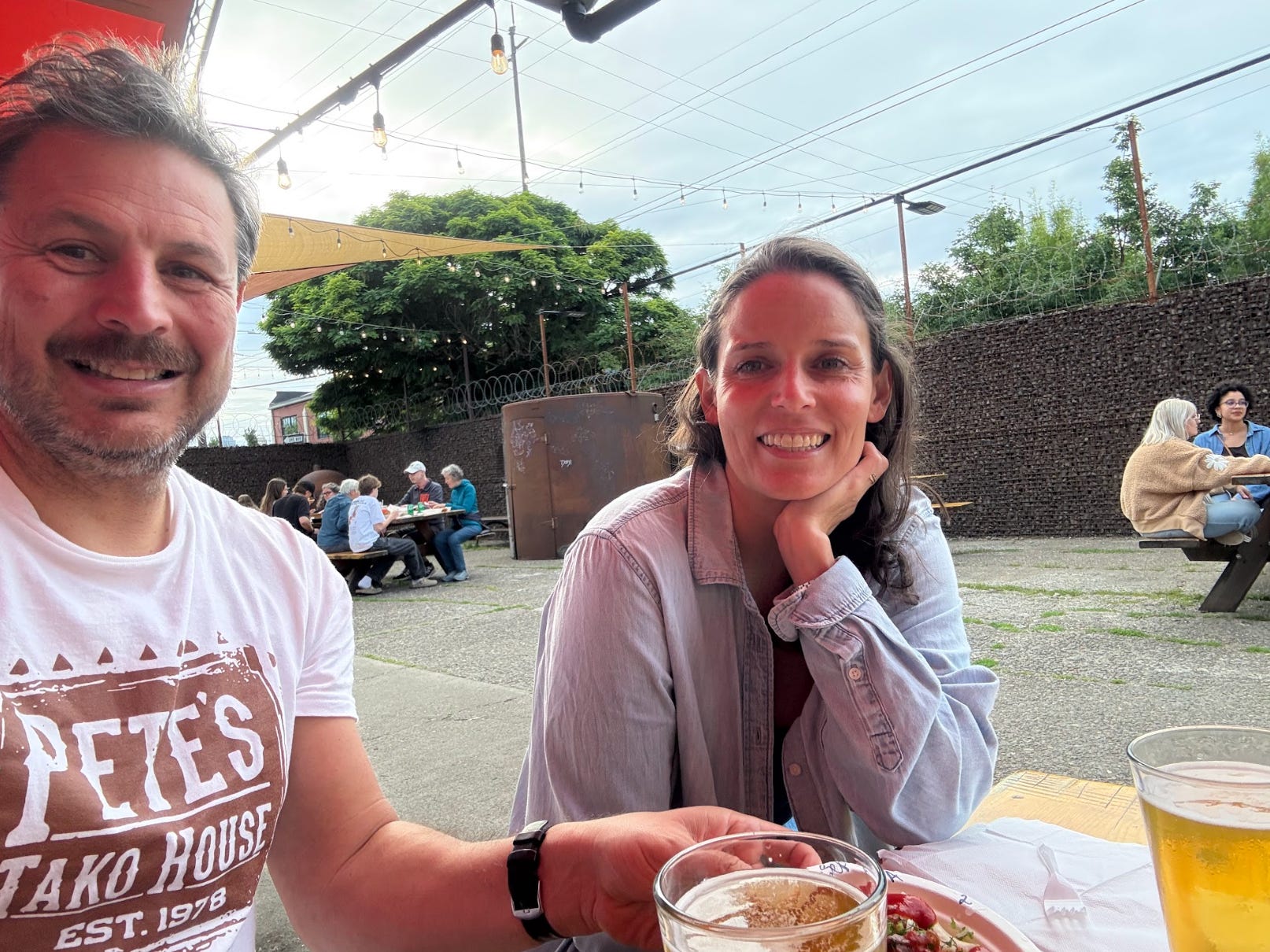 The writer and his spouse eating a meal outside in Portland.