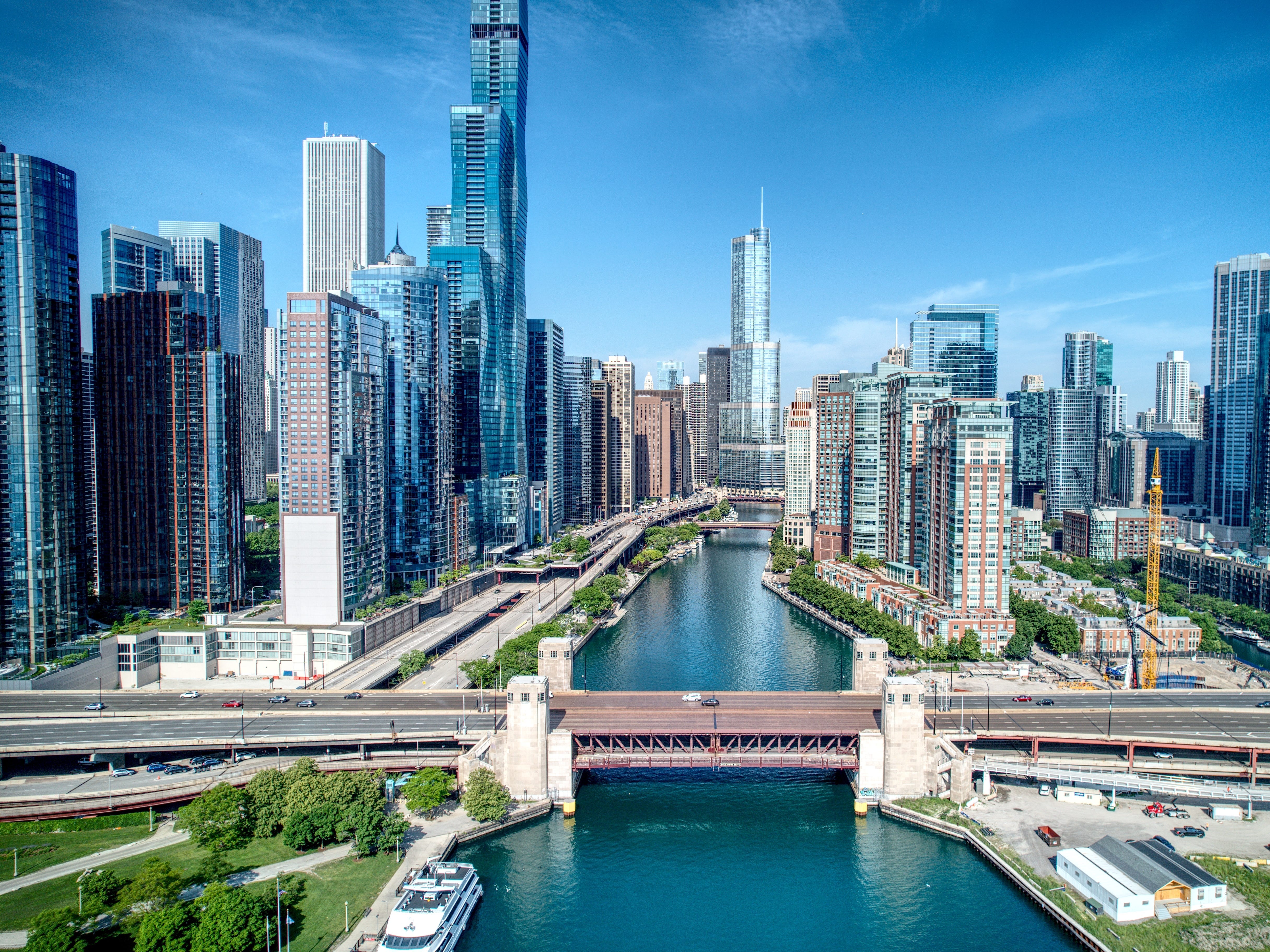 A view of the Chicago skyline with the Chicago River running down the middle of the frame.