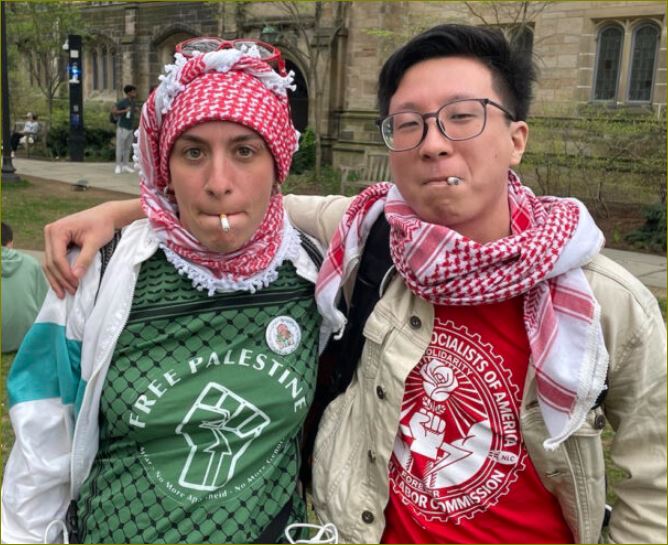 Two people wearing keffiyehs and t-shirts supporting Palestine.