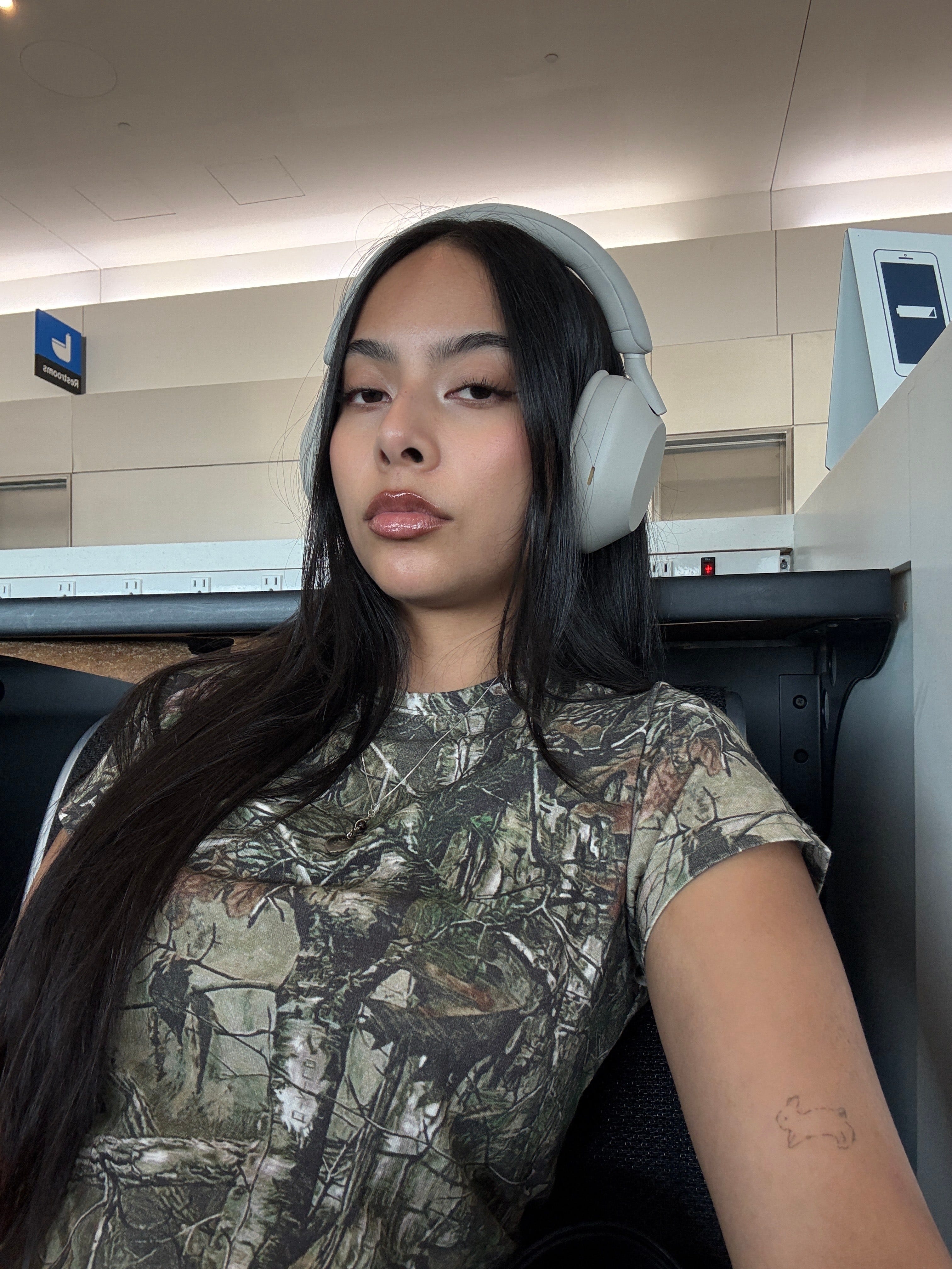 a selfie of Angl Nath showing her tiny tattoo