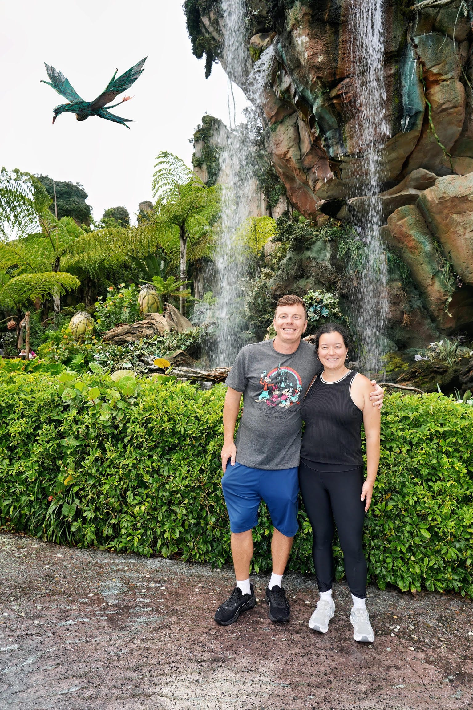 Couple pose for picture at Disney World
