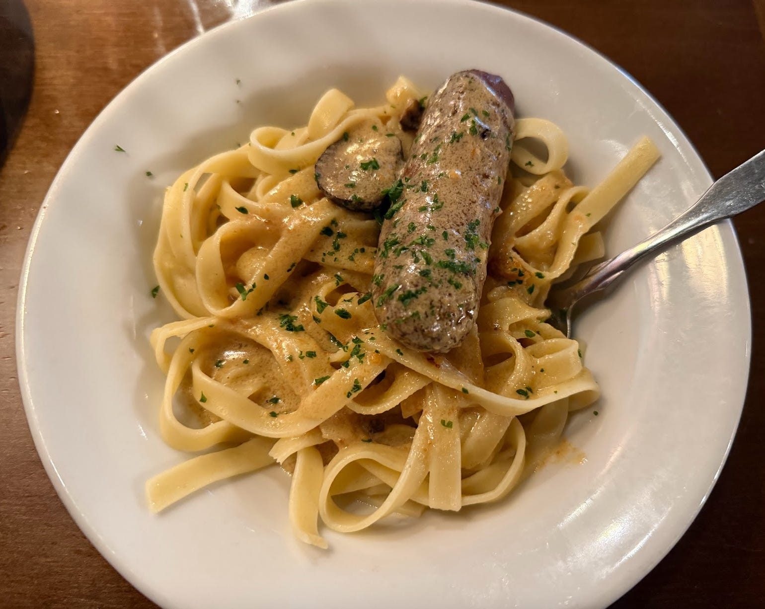 Olive Garden never-ending pasta fettuccine with creamy mushroom sauce and sausage