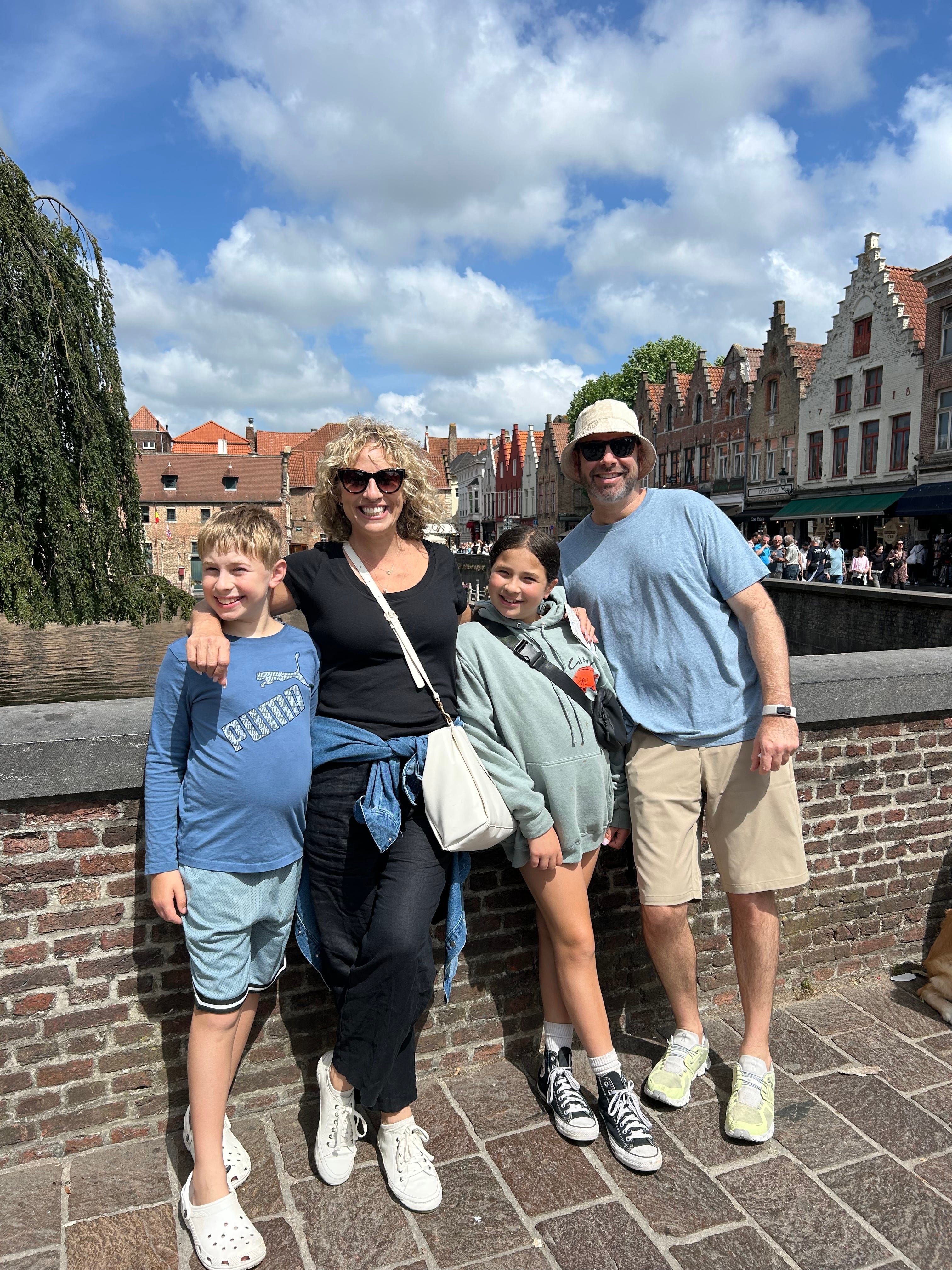 The family in Luxembourg on a bridge over a canal.