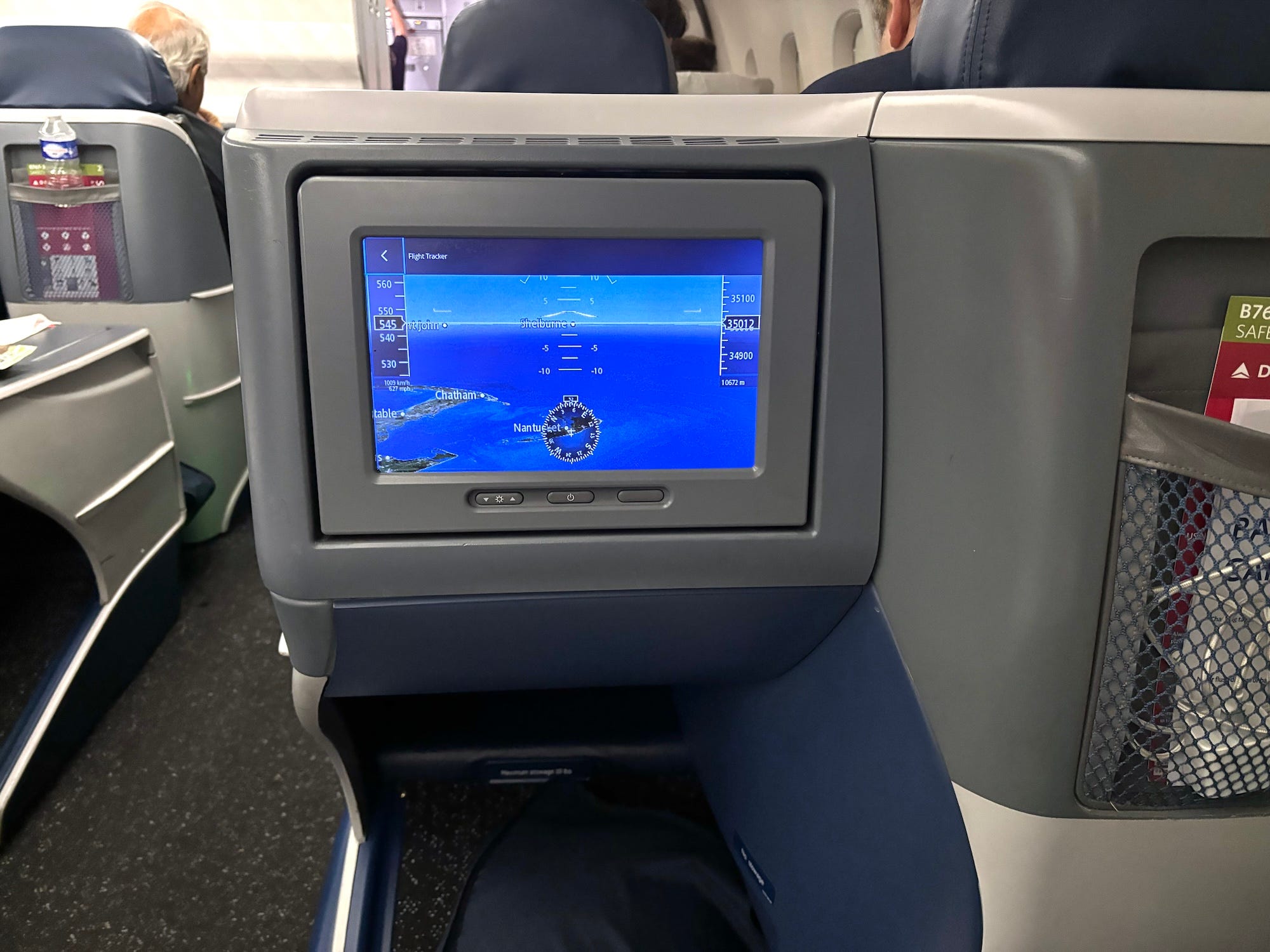 A TV screen on a plane.
