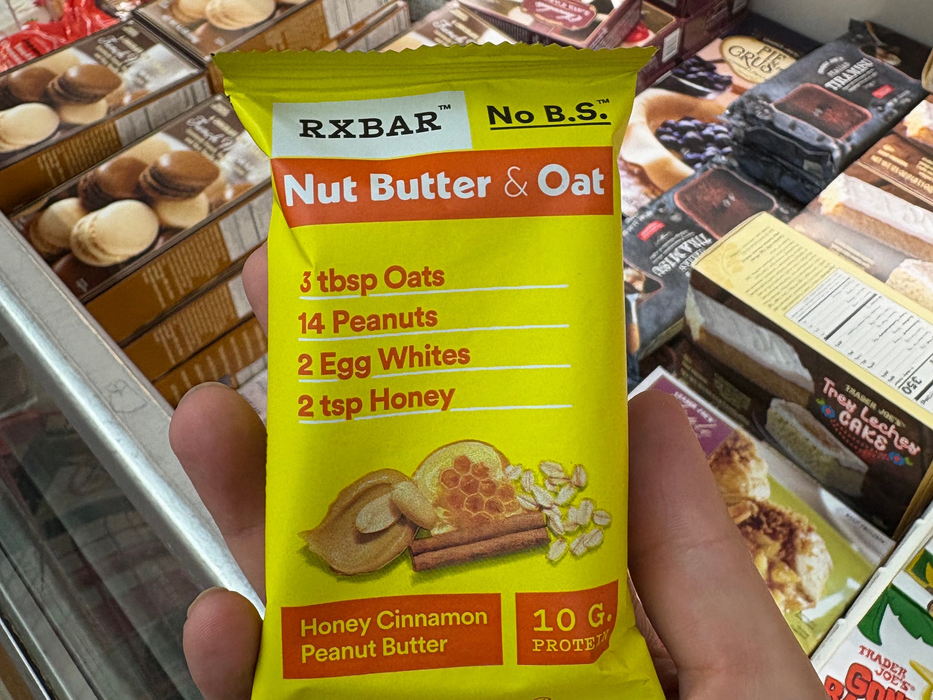 The author holding a nut butter and oat RX Bar.