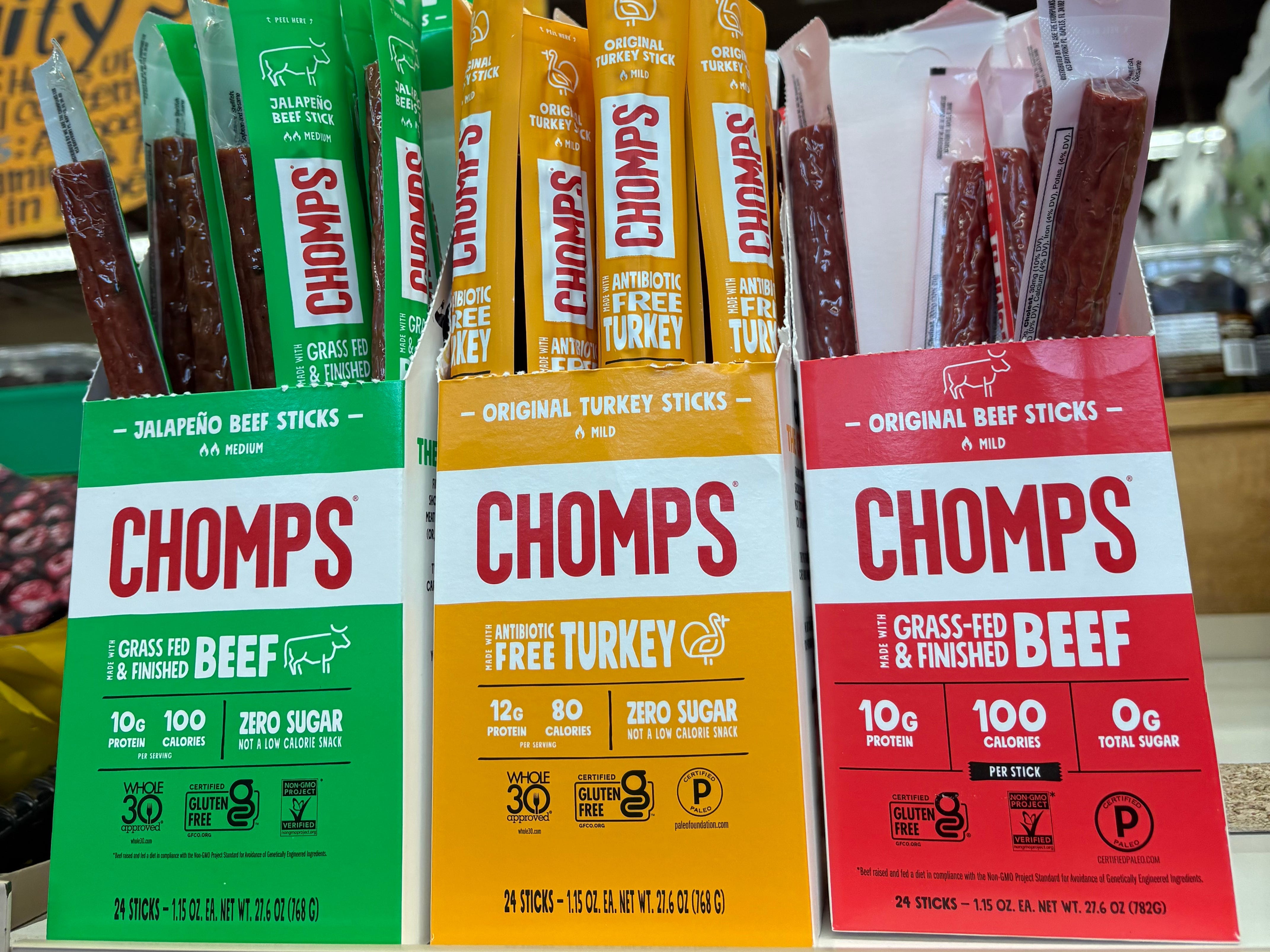A display of three flavors of Chomps at Trader Joe's.