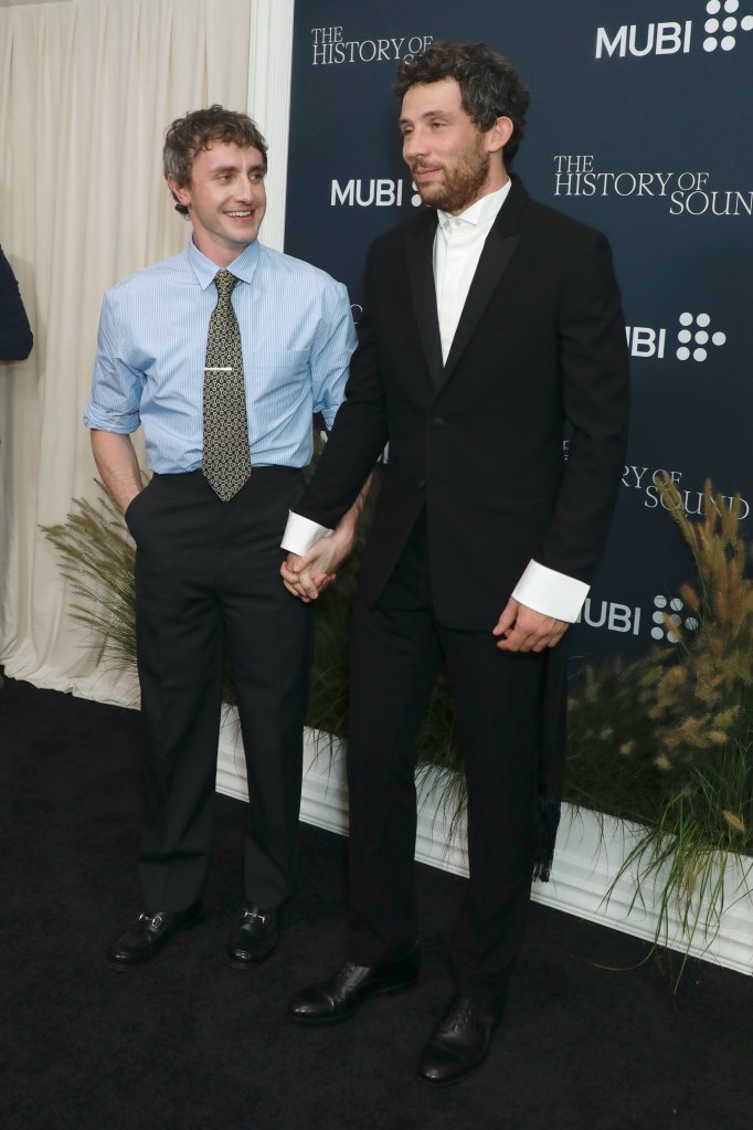 Paul Mescal (left) and Josh O’Connor hold hands for support at the premiere of their film “The History of Sound” at Lincoln Center.

