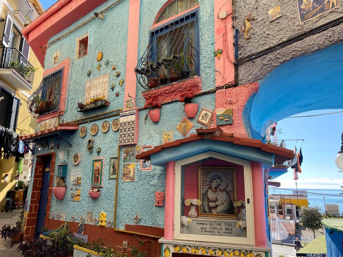 Blue and pink building exterior with artwork