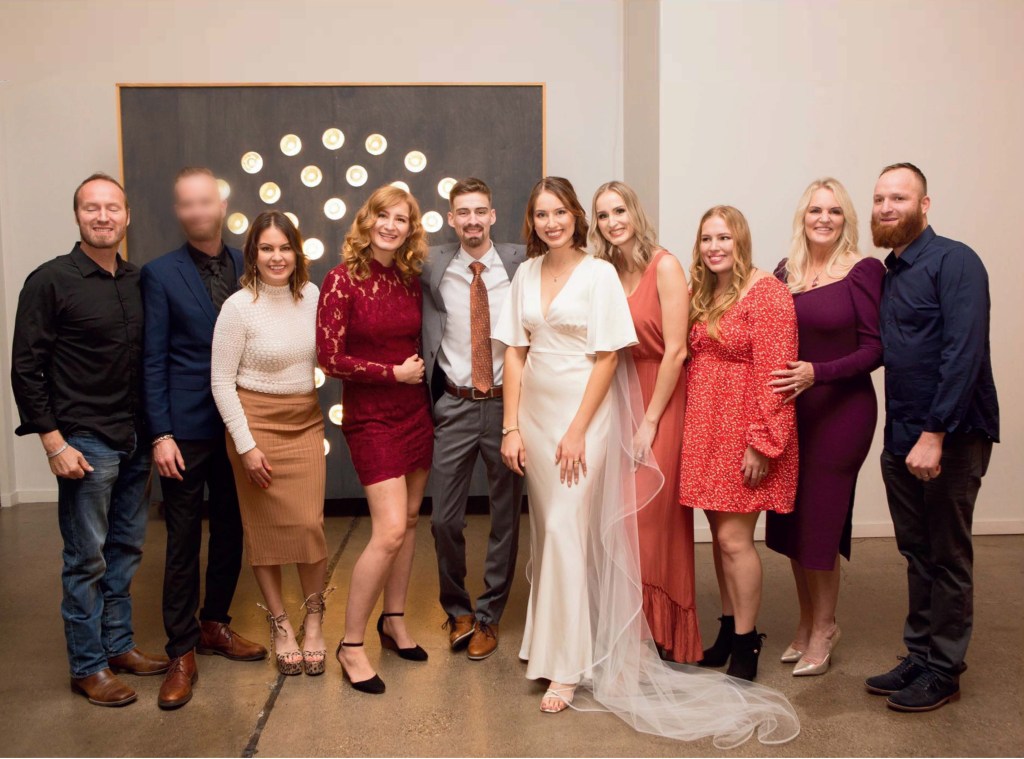 Pamela and her nine children at a wedding.