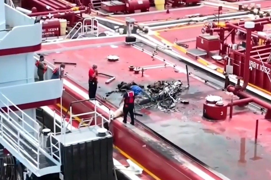 Debris of a helicopter crash on a barge.