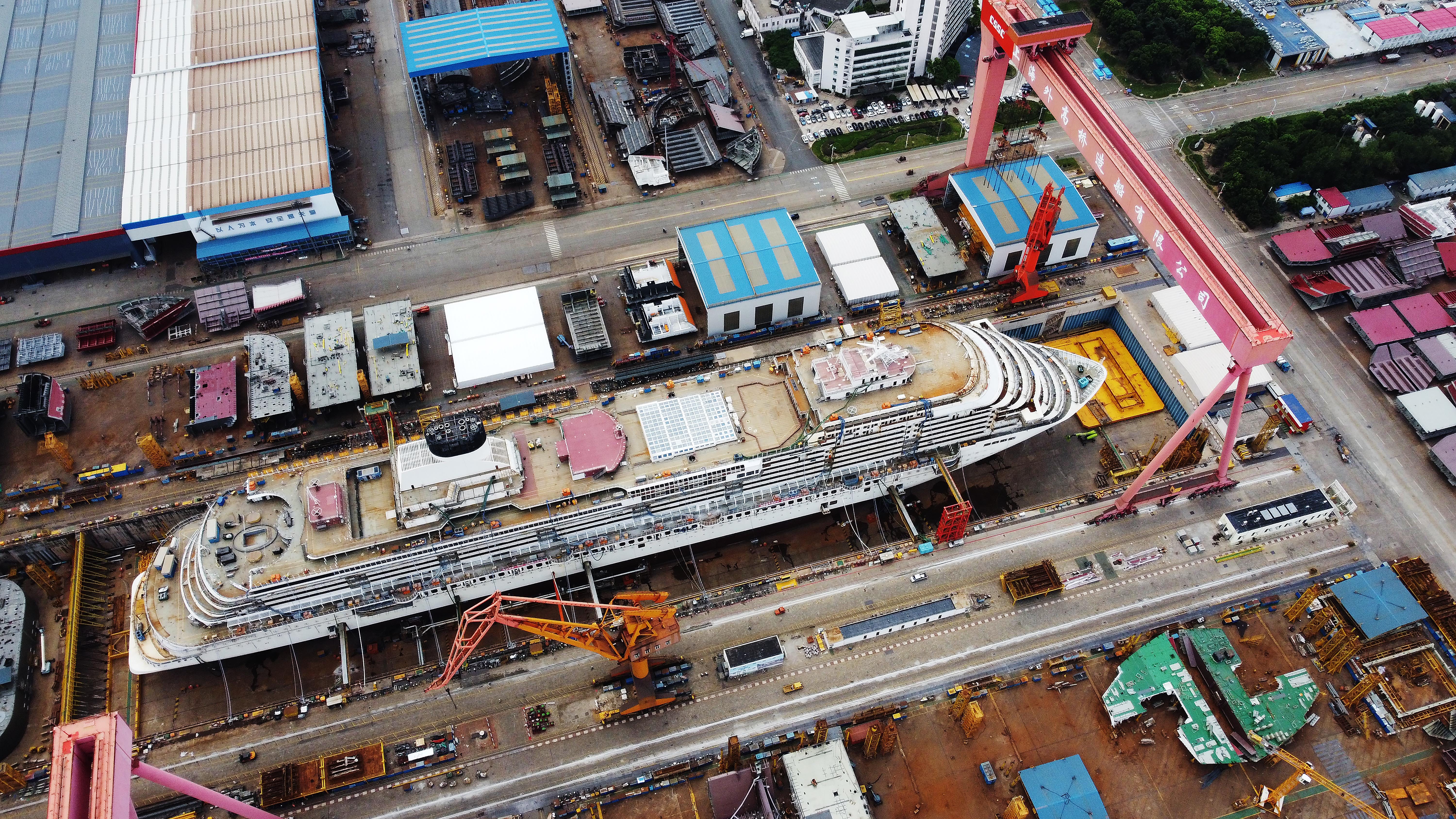 Workers at the construction site of the first built-in-China large cruise ship (H1508), a Vista-class ship owned by CSSC Carnival Cruise Shipping Co., Ltd, at a shipyard of Shanghai Waigaoqiao Shipbuilding Co Ltd, a subsidiary of China State Shipbuilding Corporation Limited (CSSC), on August 3, 2022 in Shanghai, China.