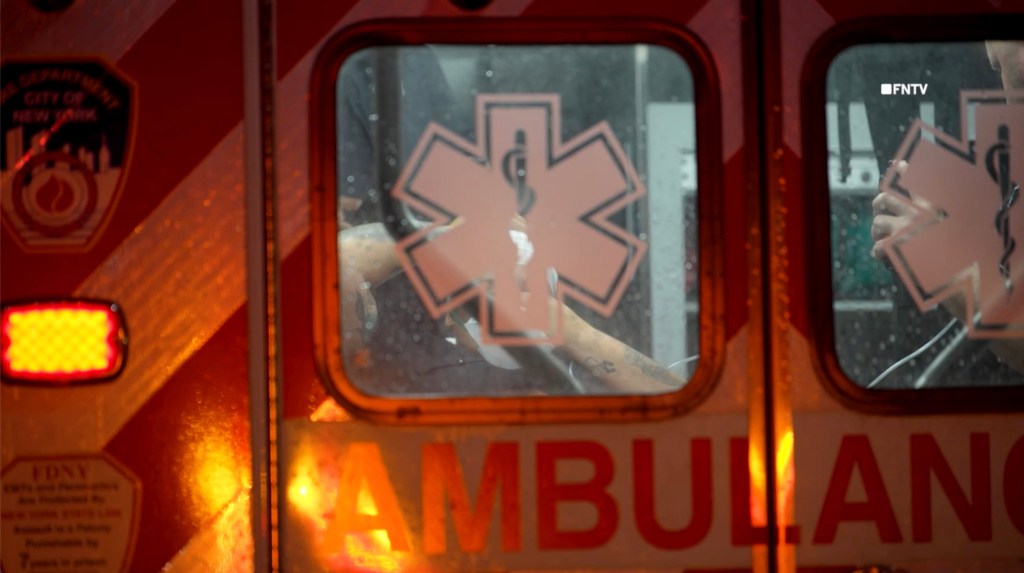 Paramedic in an ambulance after a police shooting.