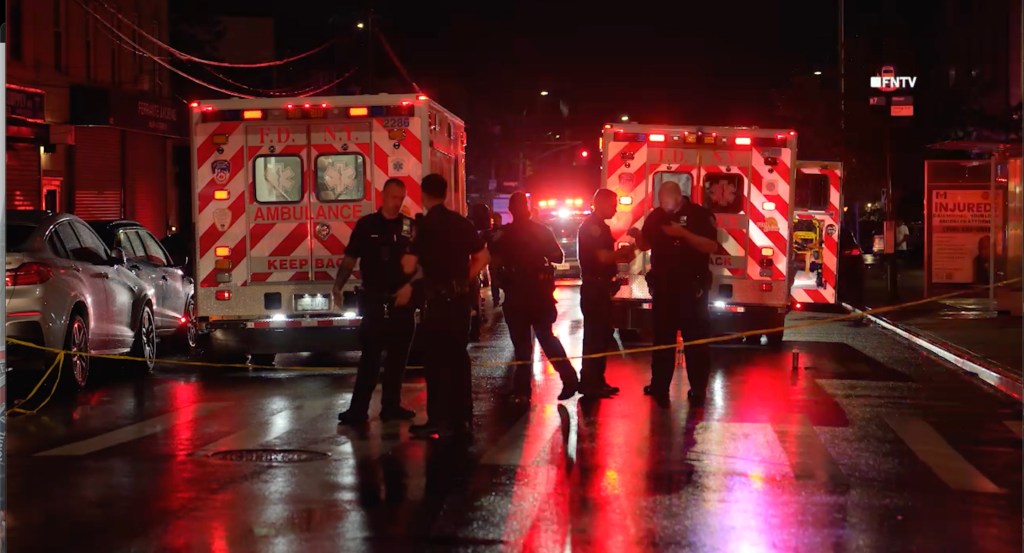 Police officers at the scene of a shooting.