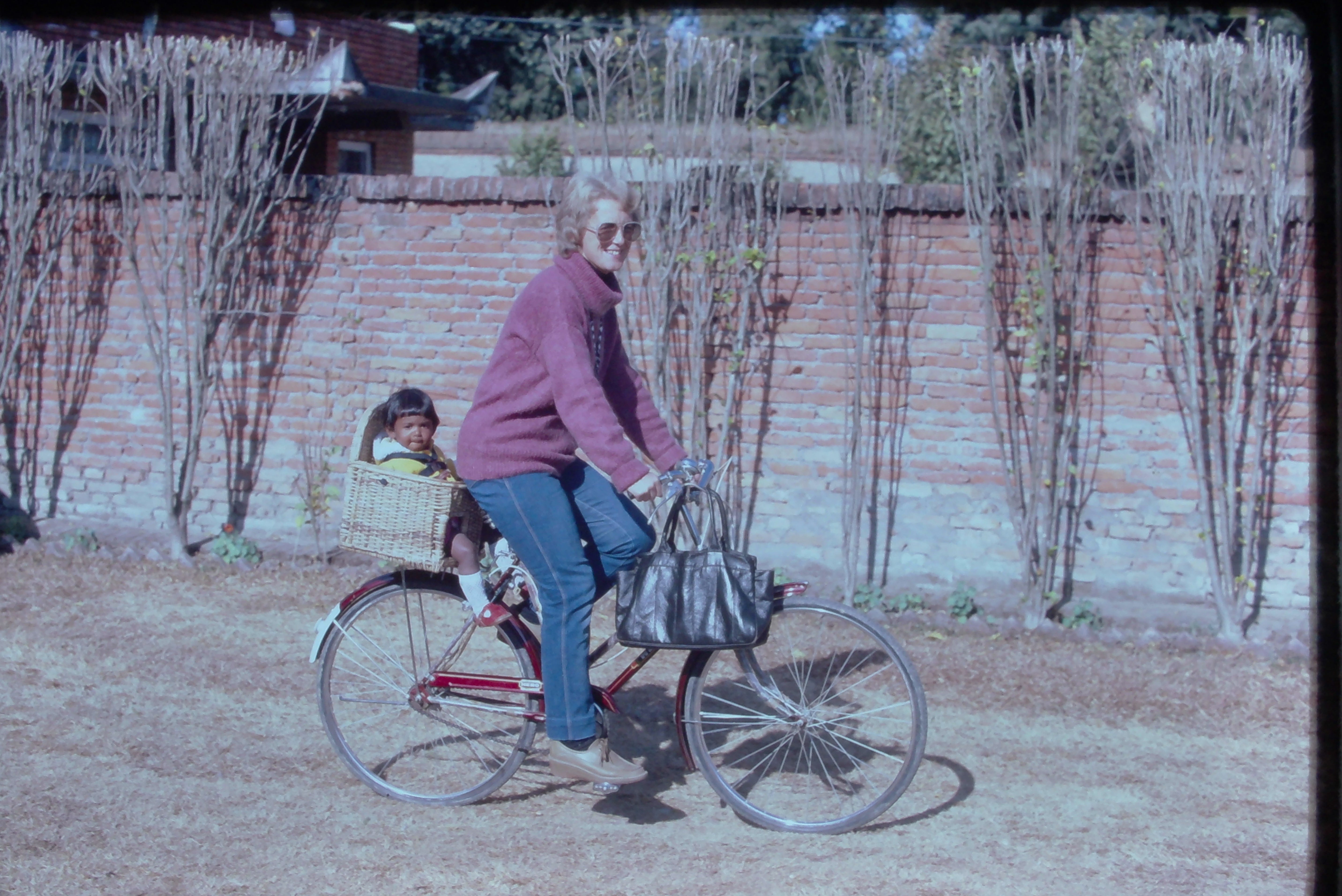 Woman on a bike with baby