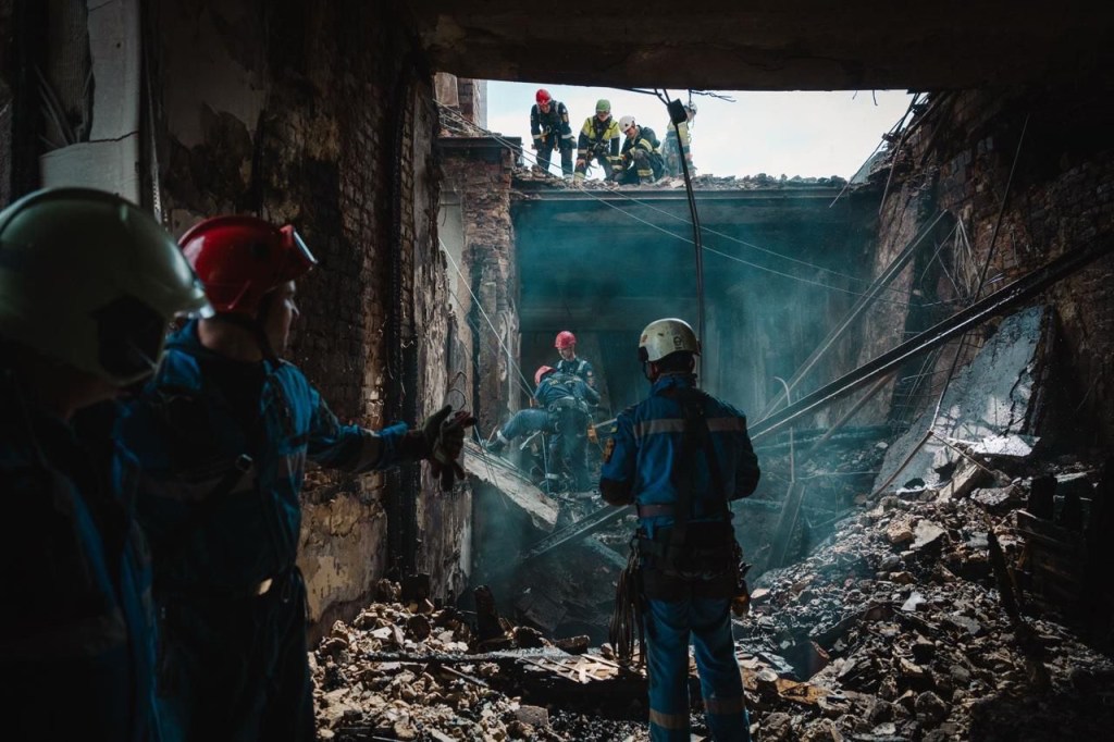 Rescue workers in a damaged building.