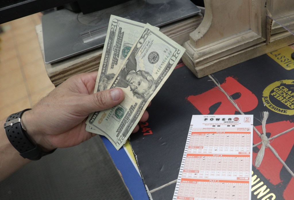 Powerball tickets are pictured as Saturday’s record-breaking drawing crowned two instant multimillionaires.
