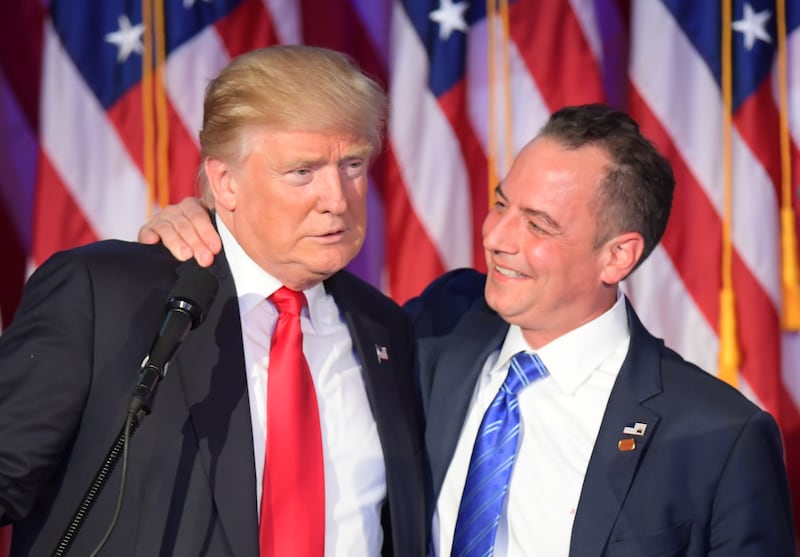 Chairman of the Republican National Committee (RNC) Reince Priebus (R) hugs Republican presidential elect Donald Trump during election night at the New York Hilton Midtown in New York on November 9, 2016. / AFP / JIM WATSON (Photo credit should read JIM WATSON/AFP via Getty Images)