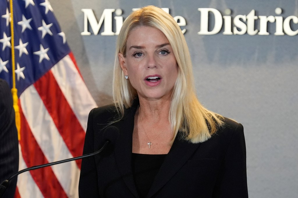 Photo of Pam Bondi speaking at a news conference.