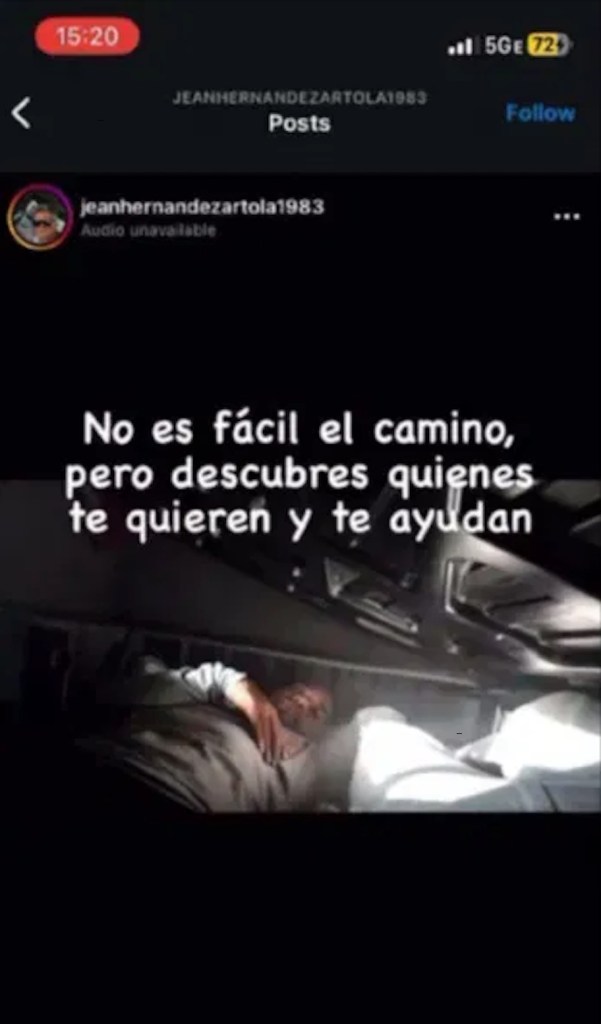 Person lying in the back of a vehicle; text overlay reads, 