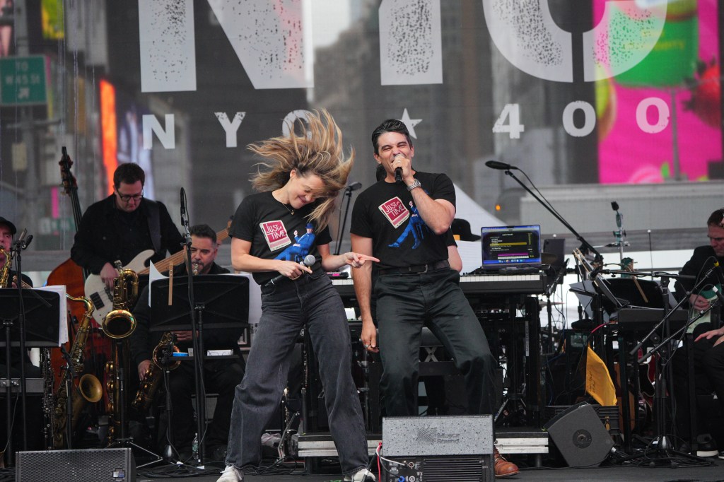 Broadway stars Erika Henningsen and Matthew Magnusson performing at a Times Square concert.