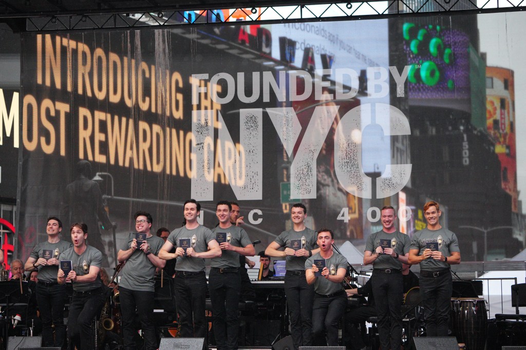 Broadway cast members performing in Times Square.