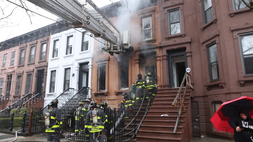 Firefighters responding to a two-alarm fire in a Brooklyn building.