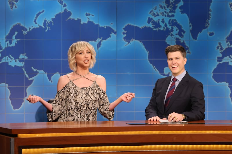 SATURDAY NIGHT LIVE -- Episode 1857 -- Pictured: (l-r) Heidi Gardner as Woman Who Is Aging Gracefully and anchor Colin Jost during Weekend Update on Saturday, March 2, 2024 -- (Photo by: Will Heath/NBC via Getty Images)