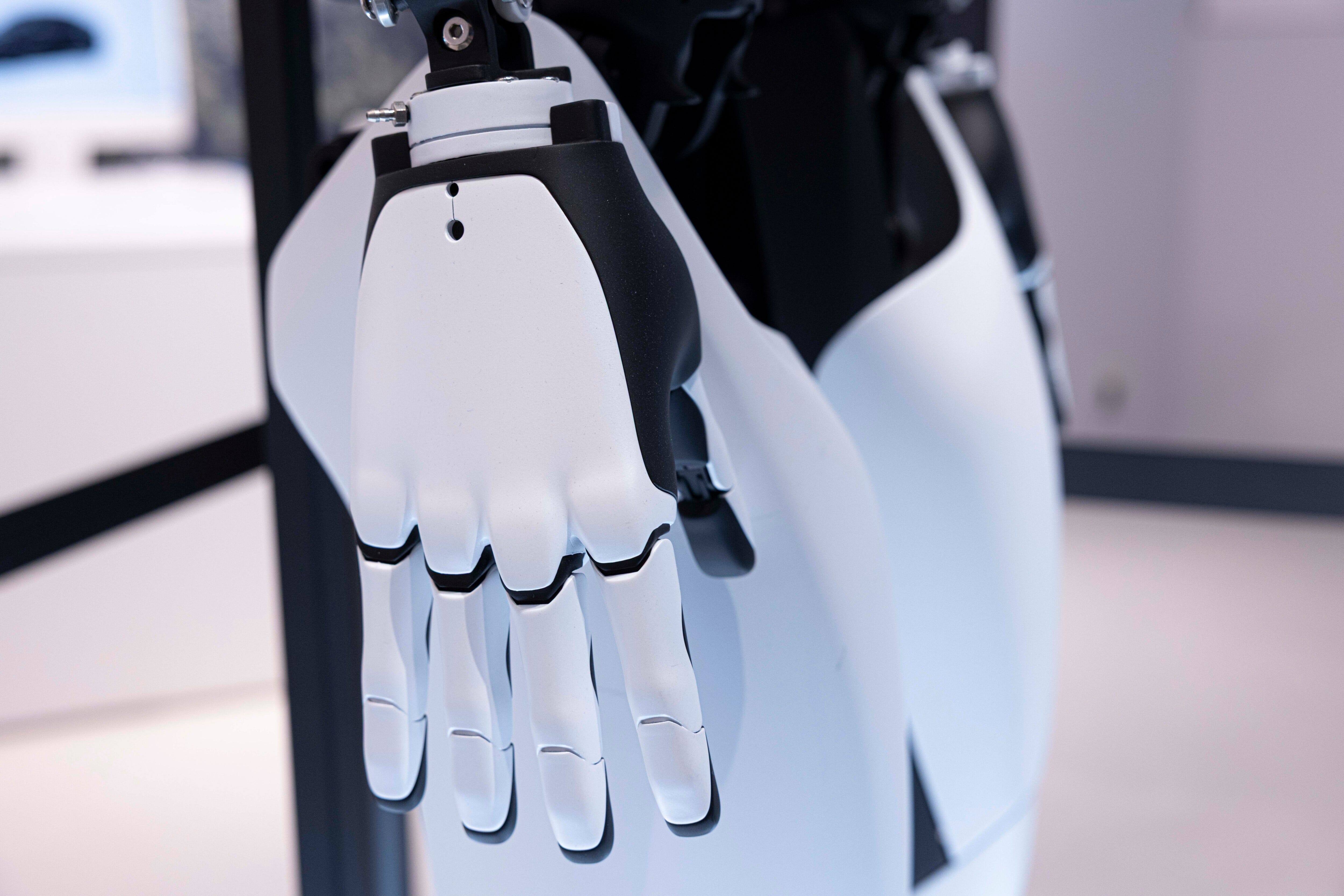 Tesla's Optimus robot on display inside the Tesla pop-up store near Shibuya crossing in April 2025.