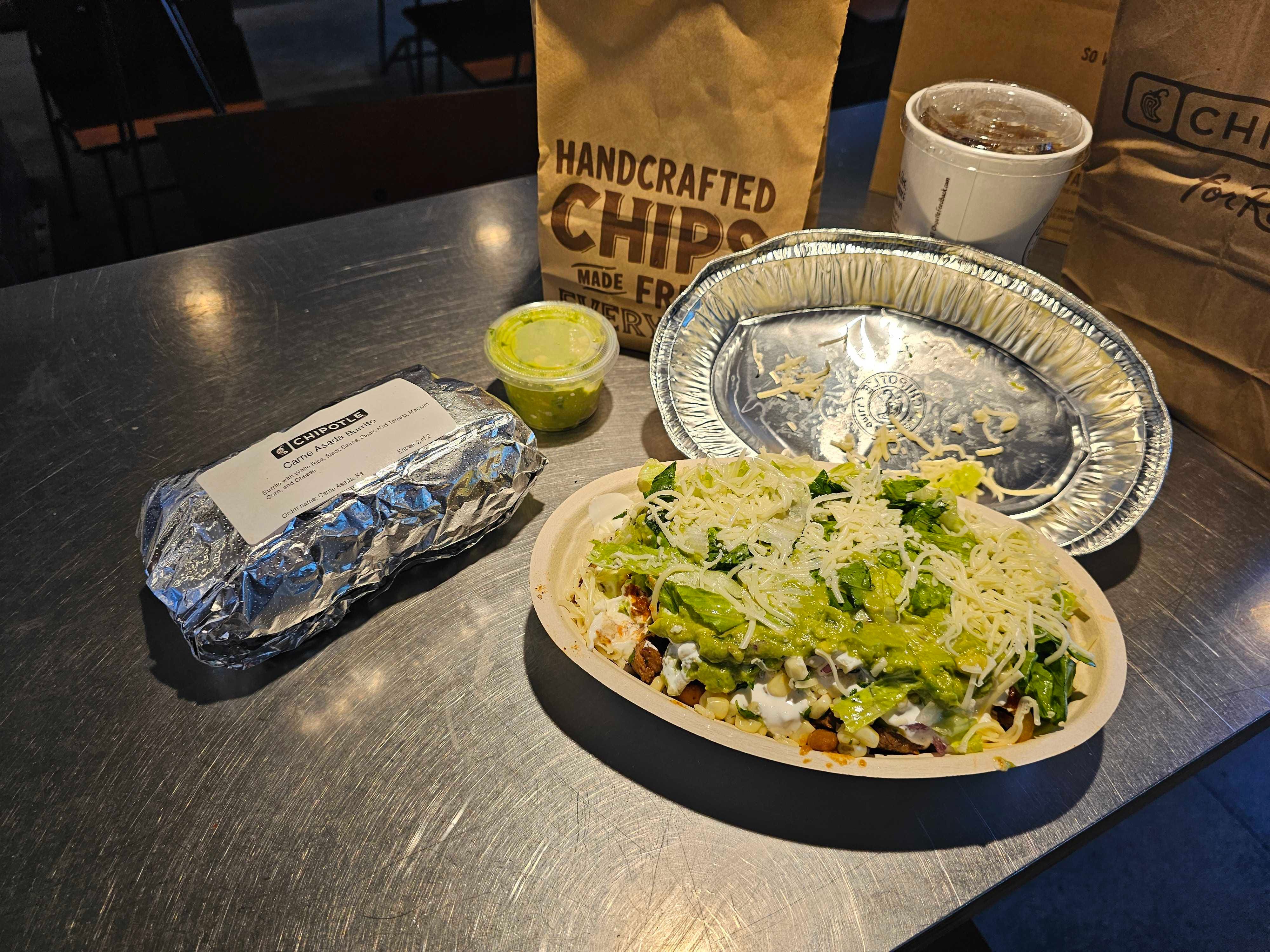A close-up of a Chipotle burrito and bowl.