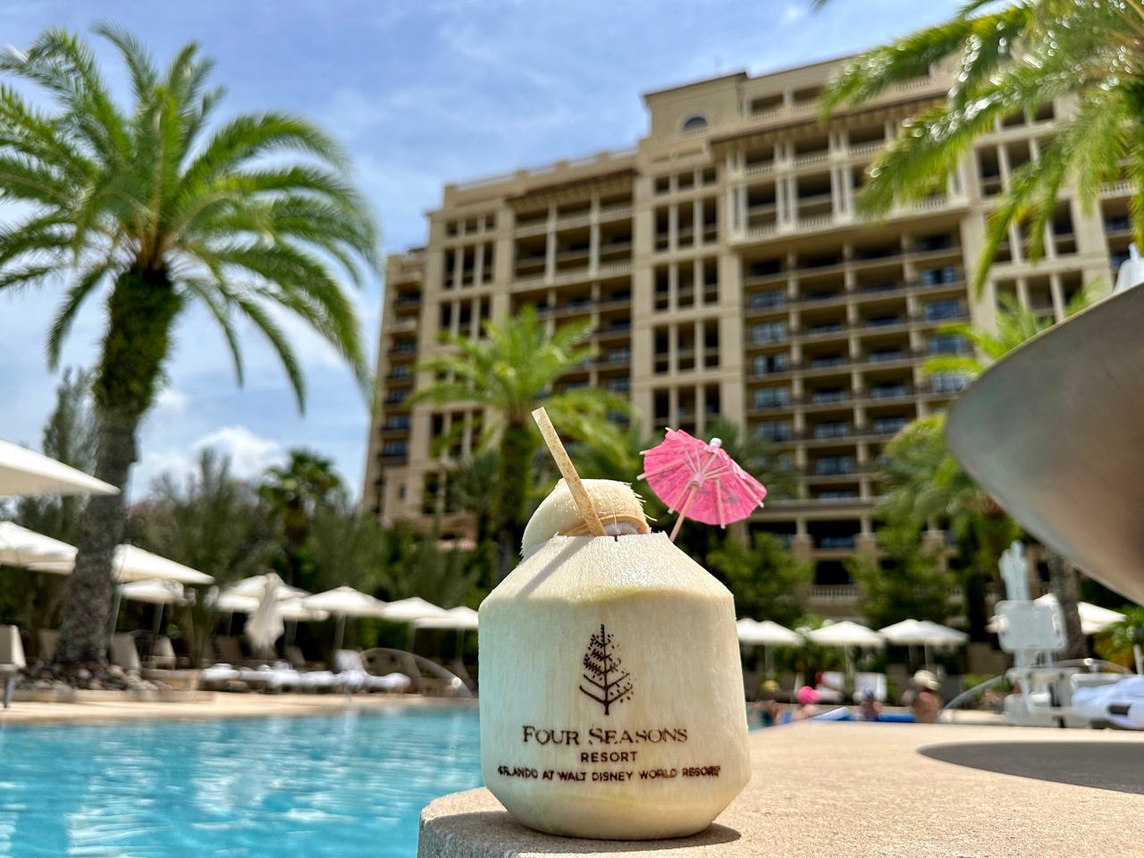 Coconut on ledge of pool at Four Seasons