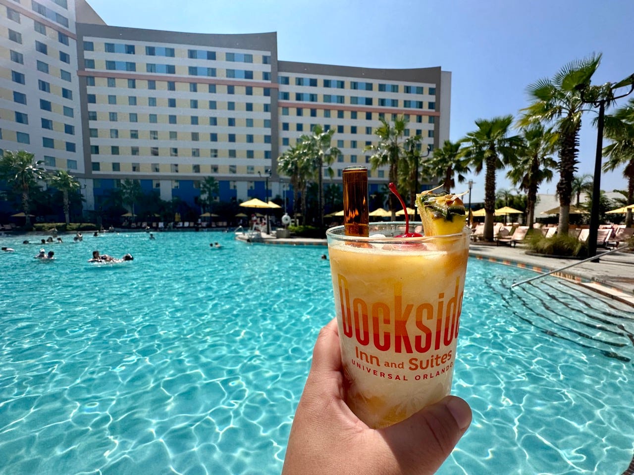 Cocktail in hand above pool at Endless Summer resort
