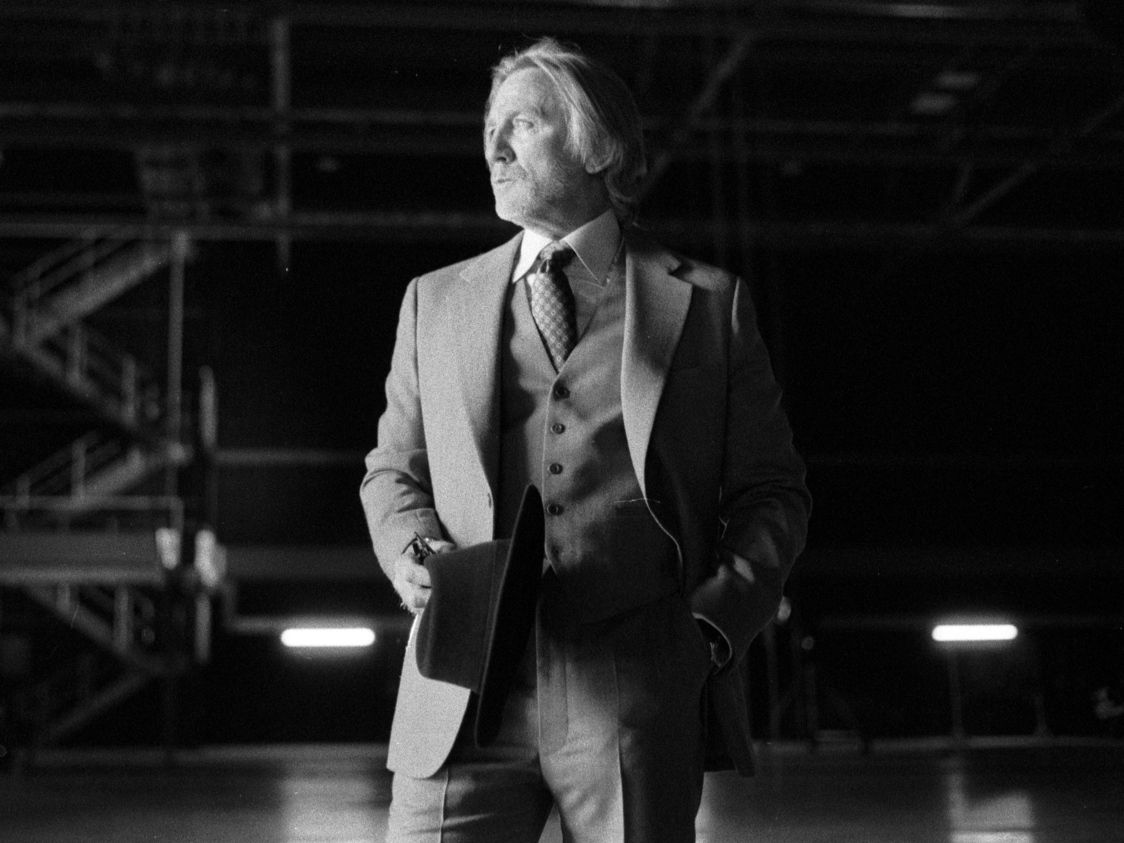 A black and white photo of Daniel Craig in a suit.