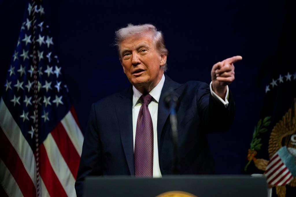 Donald Trump speaking, pointing.